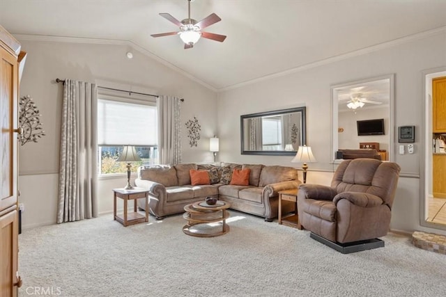 living room featuring carpet, ceiling fan, lofted ceiling, and crown molding