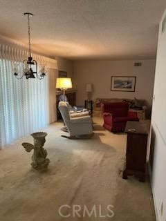 living room with carpet and an inviting chandelier