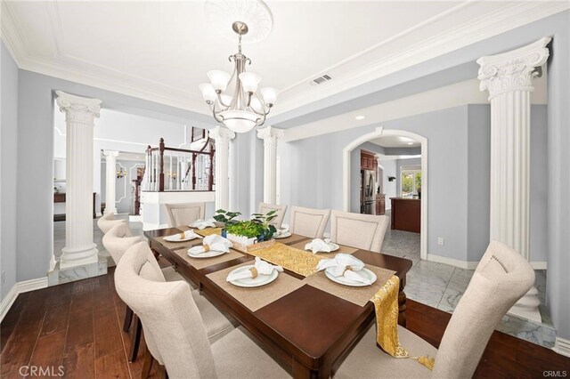 22427 Steeplechase Ln, Diamond Bar, CA 91765 - dining space featuring decorative columns, a chandelier, arched walkways, crown molding, and baseboards