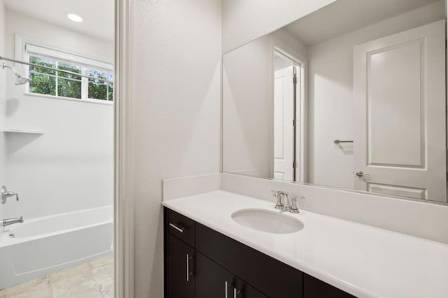 bathroom featuring vanity and shower / bathtub combination