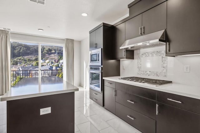 kitchen with tasteful backsplash and stainless steel appliances