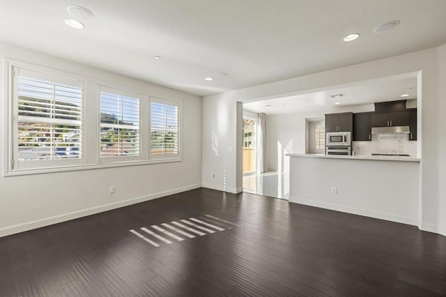 unfurnished living room featuring dark wood-type flooring