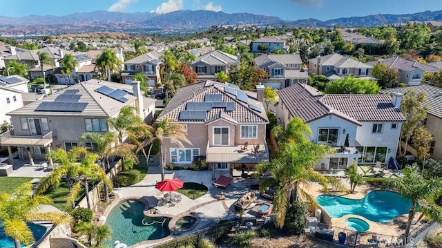 birds eye view of property with a mountain view