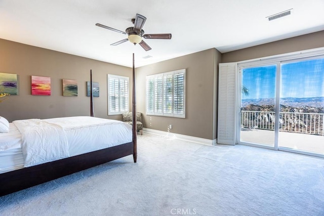 bedroom featuring light colored carpet, a ceiling fan, baseboards, visible vents, and access to outside