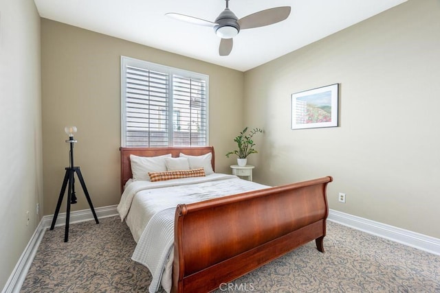 bedroom with ceiling fan, carpet, and baseboards