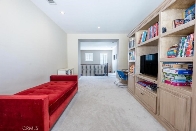 interior space featuring recessed lighting, light colored carpet, and visible vents