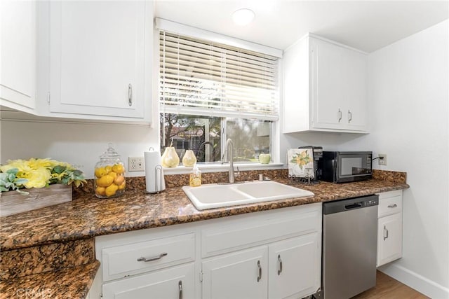 kitchen featuring dishwasher, light hardwood / wood-style floors, white cabinetry, and sink