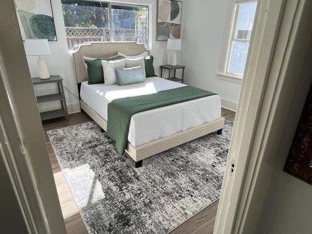 bedroom with wood-type flooring