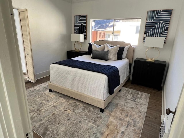 bedroom with hardwood / wood-style floors