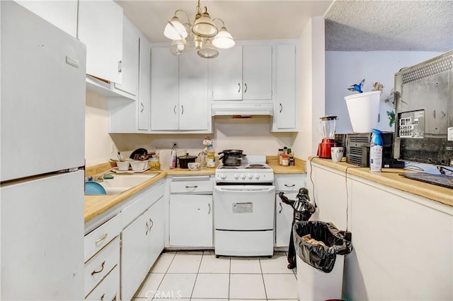 kitchen with white cabinetry, sink, a textured ceiling, white appliances, and light tile patterned flooring