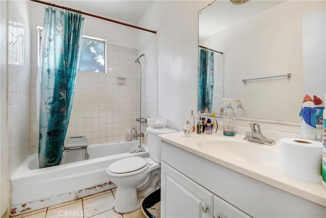 full bathroom with tile patterned floors, vanity, toilet, and shower / bath combo with shower curtain