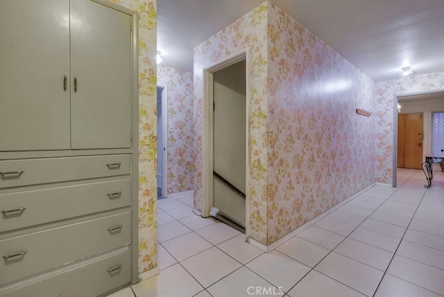 hall featuring light tile patterned flooring