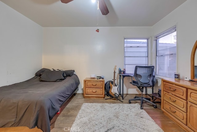 bedroom featuring ceiling fan and light wood-type flooring