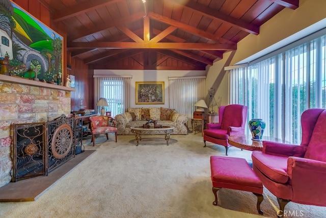 living room featuring carpet, beam ceiling, and wooden ceiling