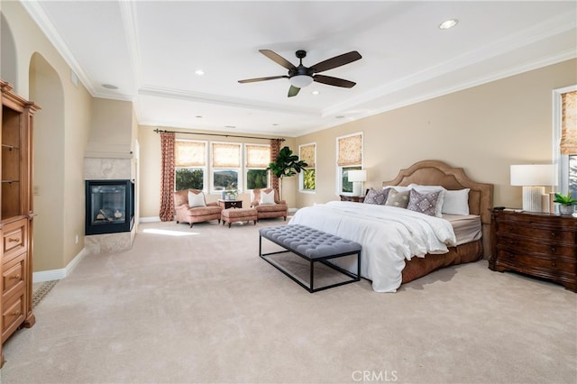 bedroom featuring light carpet, ceiling fan, and crown molding