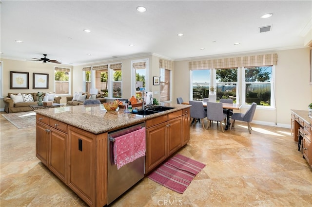 kitchen with a healthy amount of sunlight, sink, a center island, and stainless steel dishwasher