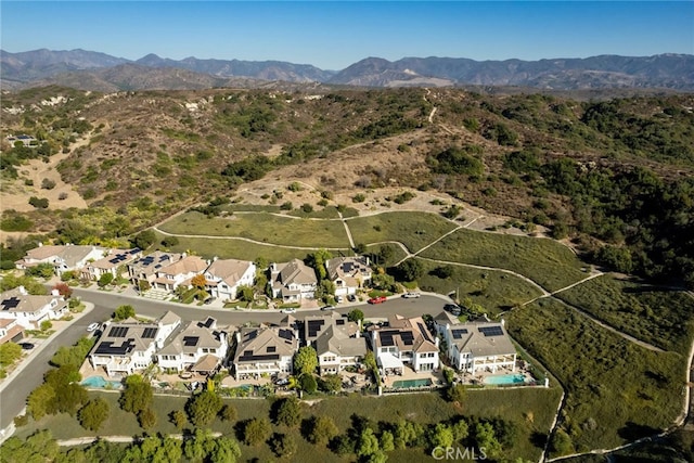 birds eye view of property with a mountain view