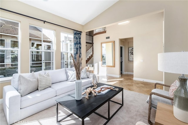 living room featuring lofted ceiling