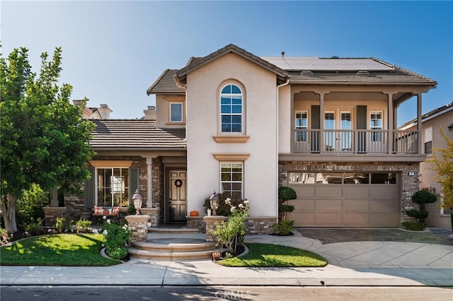 view of front of house with solar panels and a garage