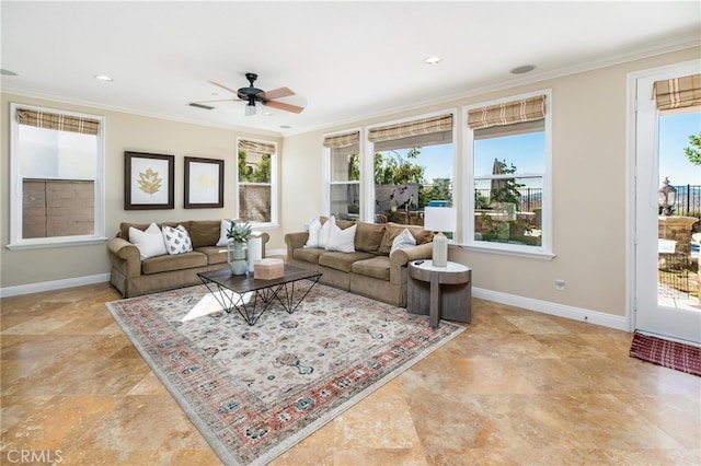 living room with ceiling fan, a healthy amount of sunlight, and crown molding