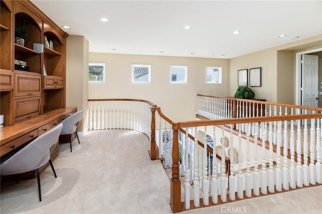 interior space with light carpet and a wealth of natural light