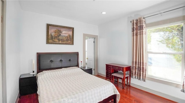 bedroom featuring hardwood / wood-style flooring