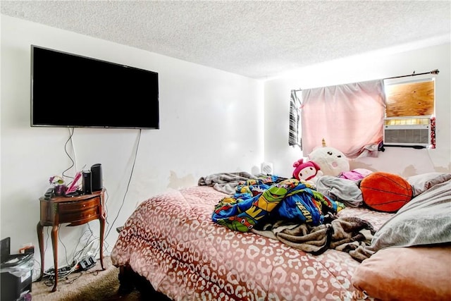 bedroom featuring a textured ceiling and cooling unit