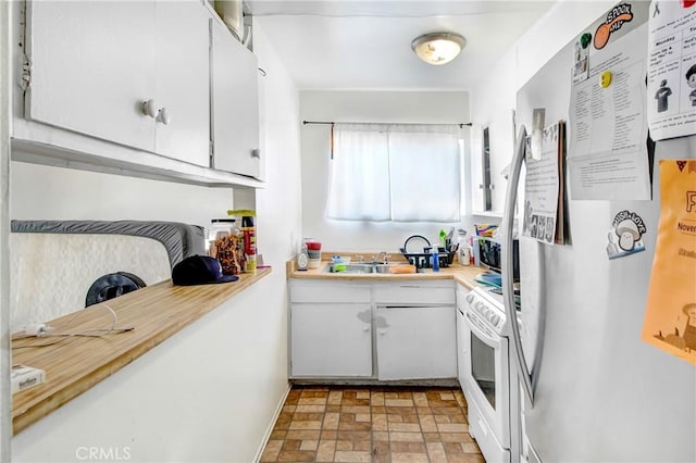 kitchen featuring white cabinetry, sink, and appliances with stainless steel finishes