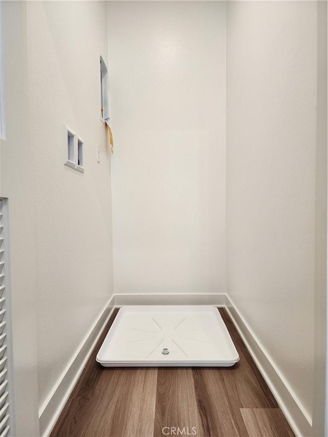 laundry room featuring washer hookup and wood-type flooring