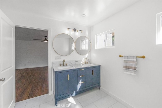 bathroom featuring tile patterned flooring, vanity, and ceiling fan