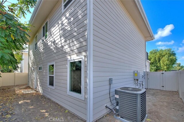 view of property exterior with central AC unit