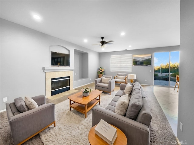 tiled living room featuring ceiling fan