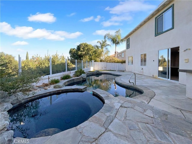 view of pool featuring an in ground hot tub and a patio