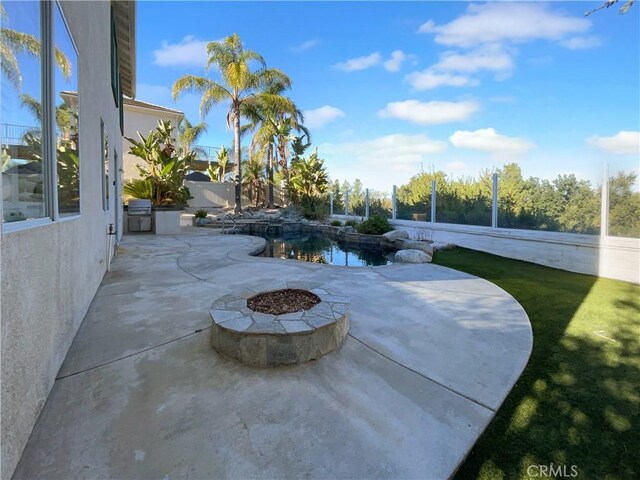 view of patio / terrace featuring a fire pit