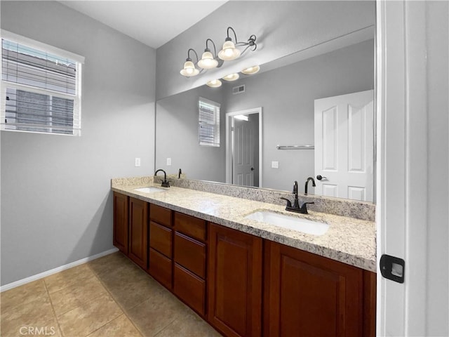 bathroom with tile patterned flooring and vanity