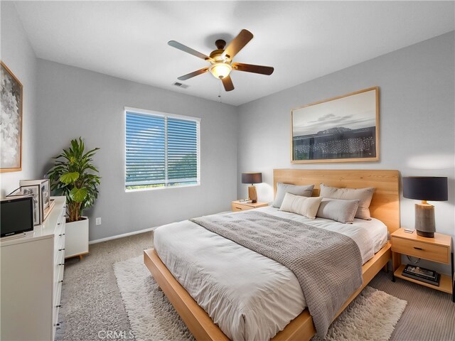 carpeted bedroom with ceiling fan