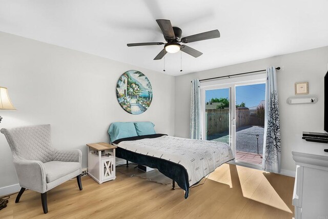 bedroom with light wood-type flooring, access to outside, and ceiling fan