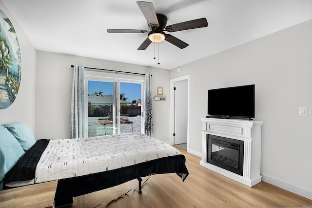 bedroom with ceiling fan and light hardwood / wood-style flooring