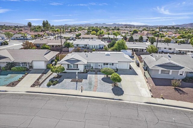 birds eye view of property featuring a mountain view