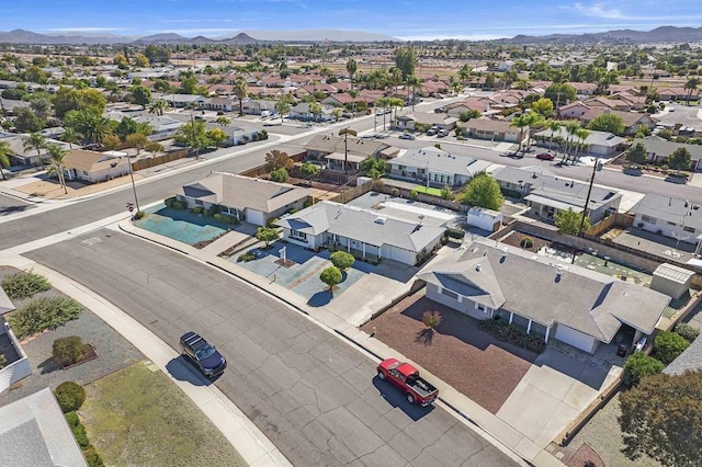 birds eye view of property with a mountain view