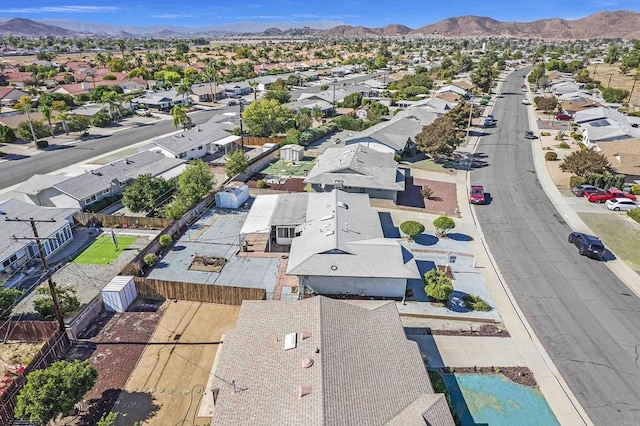 birds eye view of property with a mountain view