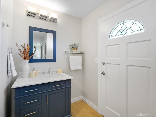 bathroom featuring hardwood / wood-style floors and vanity