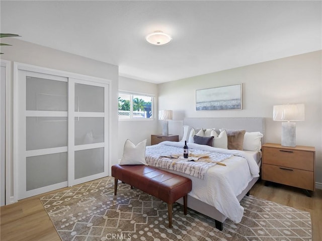 bedroom with hardwood / wood-style flooring