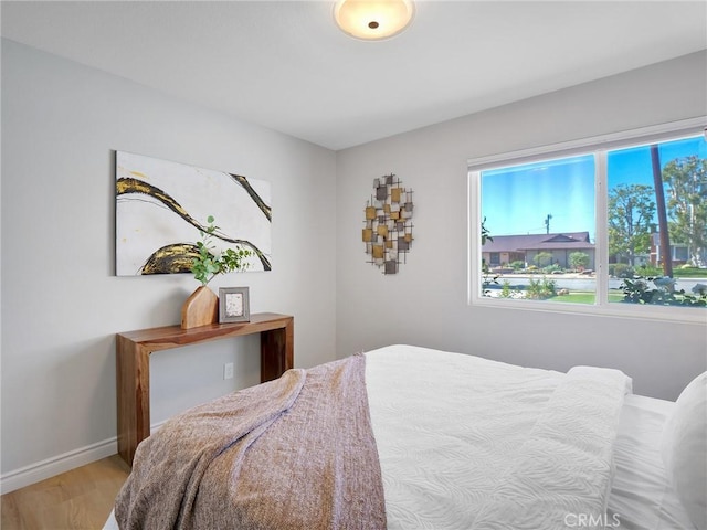 bedroom with light wood-type flooring