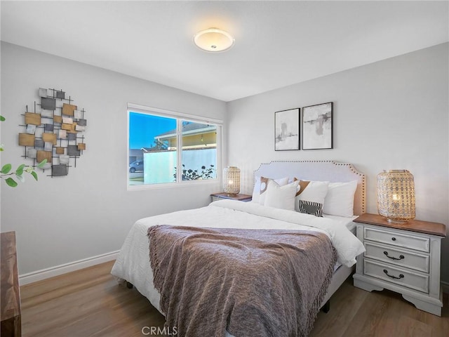 bedroom featuring dark hardwood / wood-style flooring