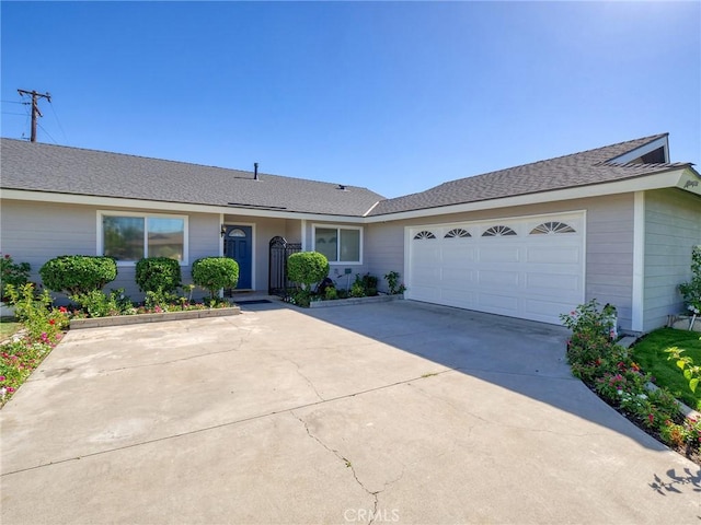 single story home with a garage