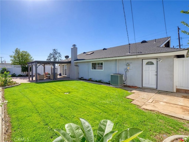 back of property with outdoor lounge area, a yard, cooling unit, and a patio