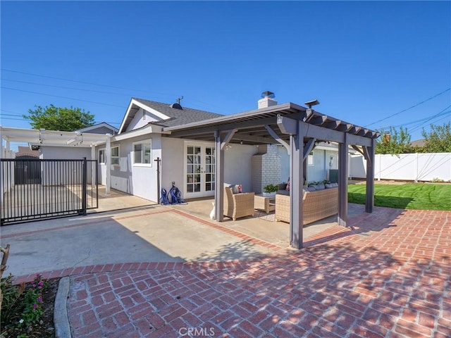 back of house with a patio area, french doors, and an outdoor hangout area