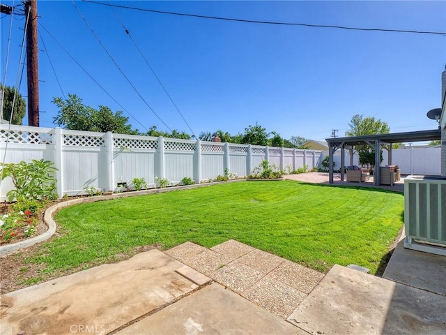 view of yard featuring central AC and a patio area