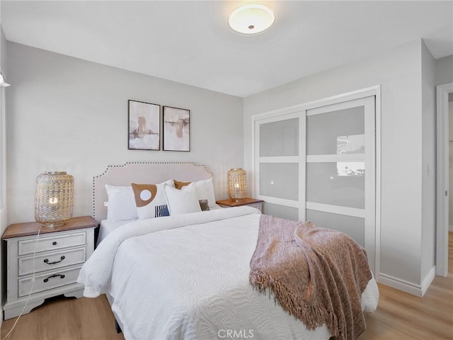 bedroom with light hardwood / wood-style floors